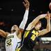 Michigan junior Jordan Morgan and Iowa freshman Mike Gesell battle for a rebound during the second half against Iowa at Crisler Center on Sunday, Jan. 6. Michigan beat Iowa 95-67 in the Big Ten home opener. Melanie Maxwell I AnnArbor.com